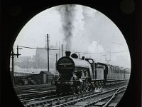 &copyTheCarterTribe.com 2013  Great Northern Railway 'Atlantic' No.1418, which was turned out of Doncaster Works in May 1906 to the design of H. A. Ivatt. It is seen working an express and the first coach appears to be a Lancashire and Yorkshire vehicle, possibly a through coach to the L&Y system via Wakefield (Information from Gareth Spencer).   Scanned from a 3.25" glass slide